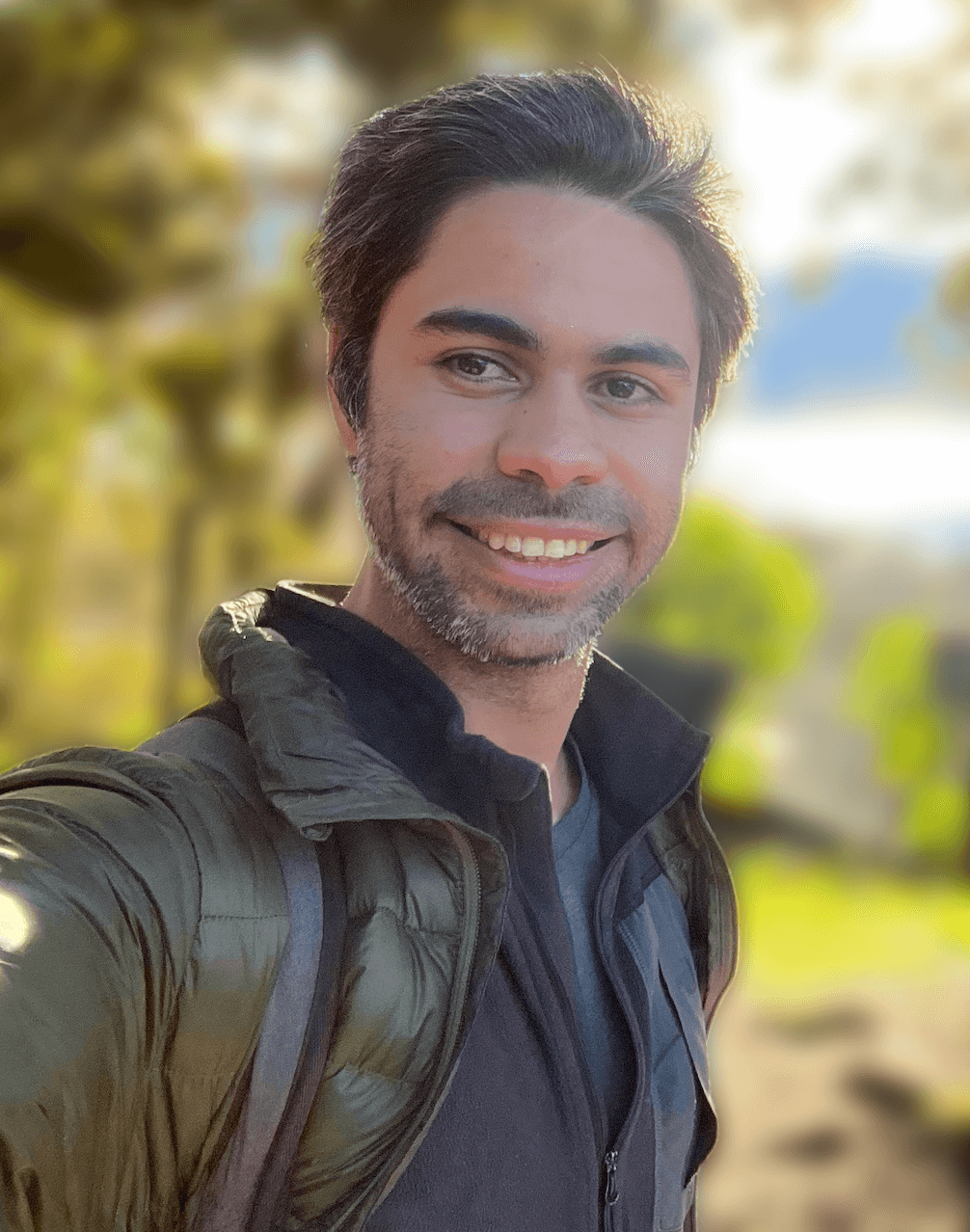 Felipe on an island smiling